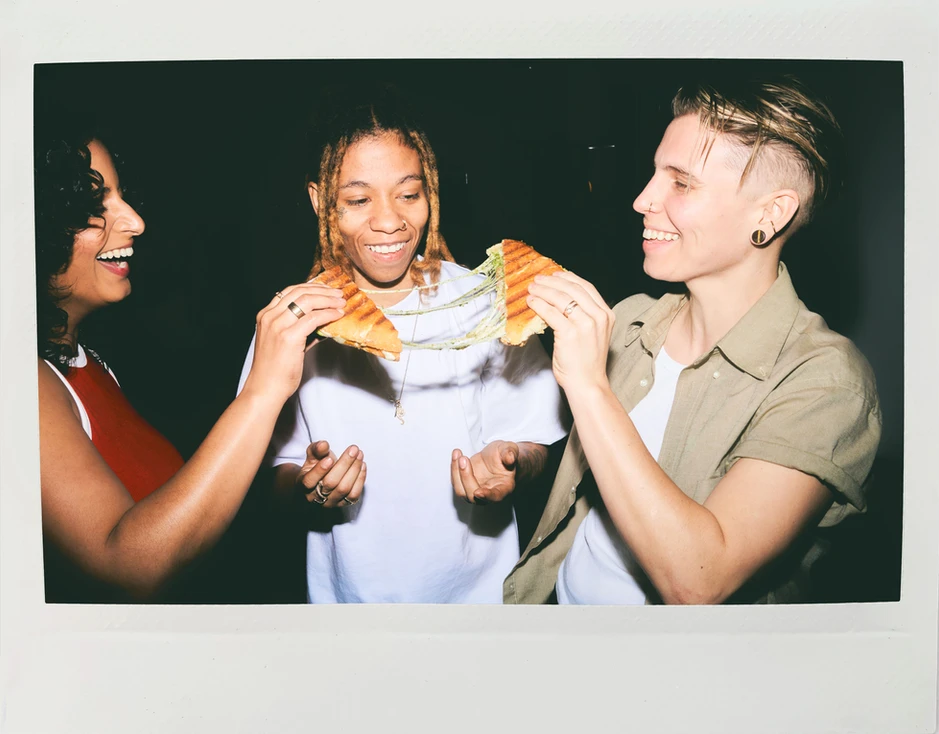 Three People in a Circle, Sharing Sandwich